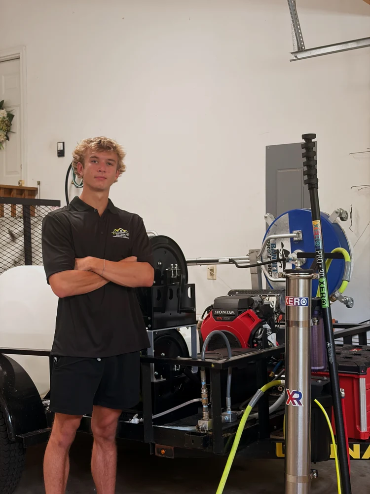 Andrew Riley, A Plus Exteriors owner, beside his cleaning equipment
